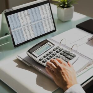Image of Man Calculating Invoices